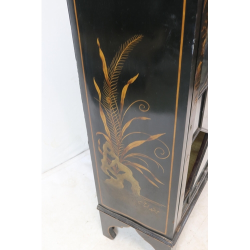 174 - Ebonised display cabinet in oriental style with gold chinoiserie decoration (one pane of glass missi... 