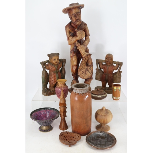 254 - Assorted items to include ethnic carvings, ceramic vase with wicker top