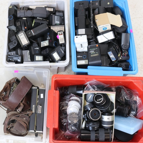 129 - Large quantity of cameras accessories, lenses, flashes etc together with a cased scale