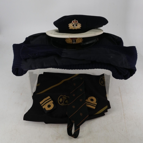 133 - Two naval officers uniforms and accessories