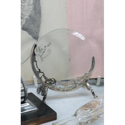 107 - A silver picture frame with front bevelled edge glass and back glass plate together with, sovereign ... 