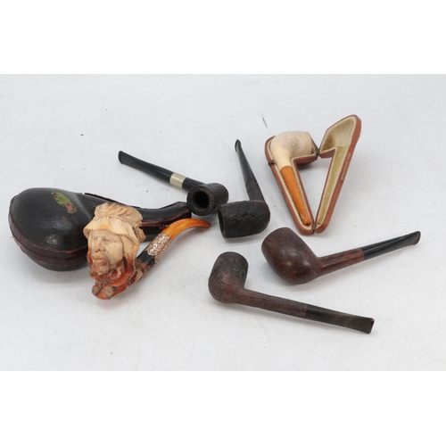 128 - Antique meerschaum pipe in broken case together with a cased meerschaum and amber pipe and four loos... 