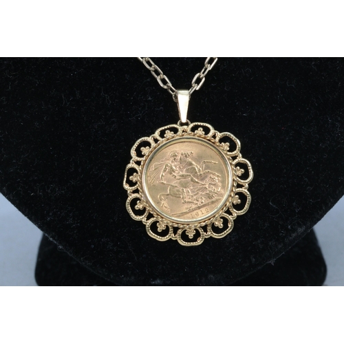 241 - George V 1912 Full Sovereign with George and Dragon obverse, set in 9ct gold floral circular pendant... 