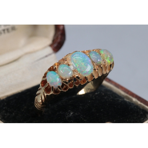 262 - An 18ct gold ring set with opals