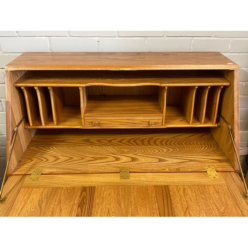 415 - An Ercol Colonial?  bureau with two drawers and cupboard under (measures approx. W93cm x D44cm x H11... 