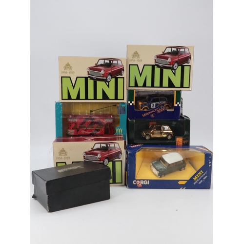 567 - Selection of Diecast mini vehicles including an Austin Rover chrome finish model on plinth. (8)