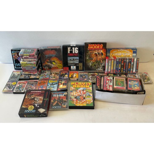 573 - Commodore 64 with accessories and a large quantity of assorted games to include  Turbo Outrun, Trans... 