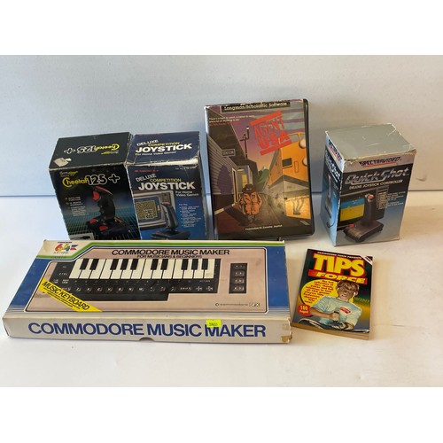 573 - Commodore 64 with accessories and a large quantity of assorted games to include  Turbo Outrun, Trans... 