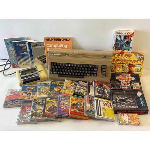 573 - Commodore 64 with accessories and a large quantity of assorted games to include  Turbo Outrun, Trans... 