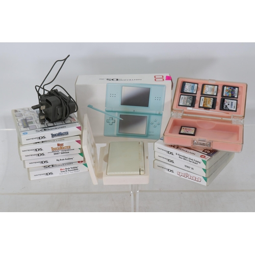 22 - Two Nintendo DS Light with a quantity of games (not checked for completeness) TRADE/SPARES/REPAIRS