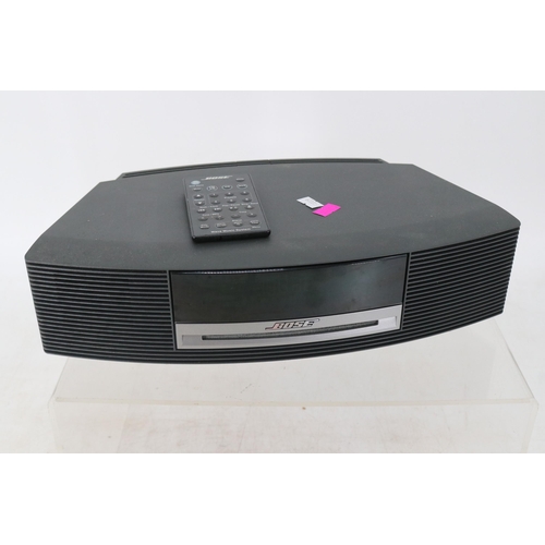 44 - A Bose music system with remote - no power cable. Model number AWRCC5. Trade spares or repairs.