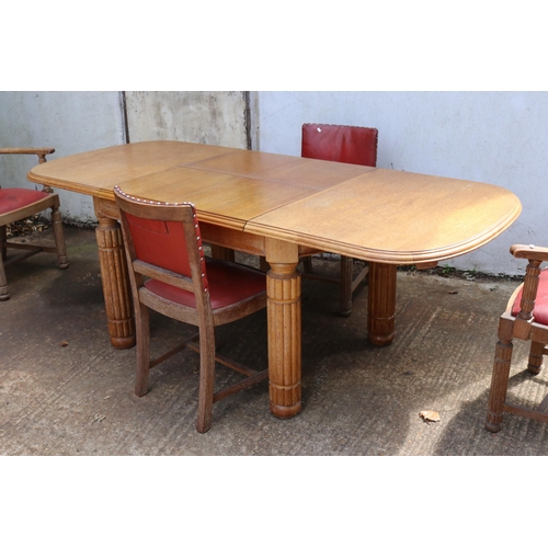 393 - Ee-zi-way one motion extending oak dining table with six chairs and two carvers measures approx. ext... 