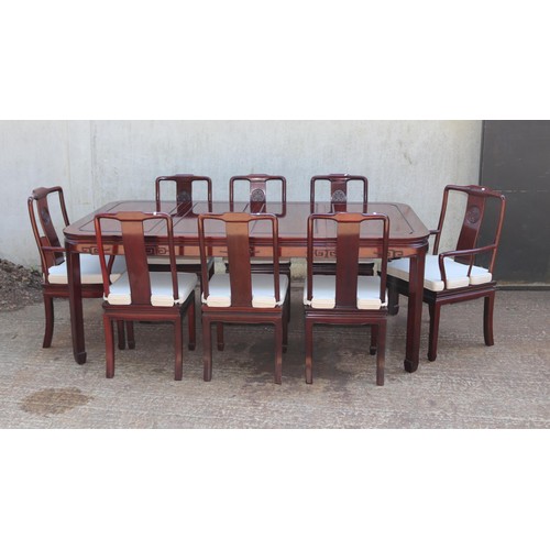 195 - Chinese rosewood dining table together with six chairs and two carvers, two leaves to extend, orient... 