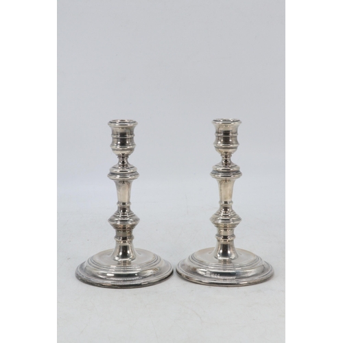 9 - A pair of silver weighted candlesticks (approx. total weight 660g)