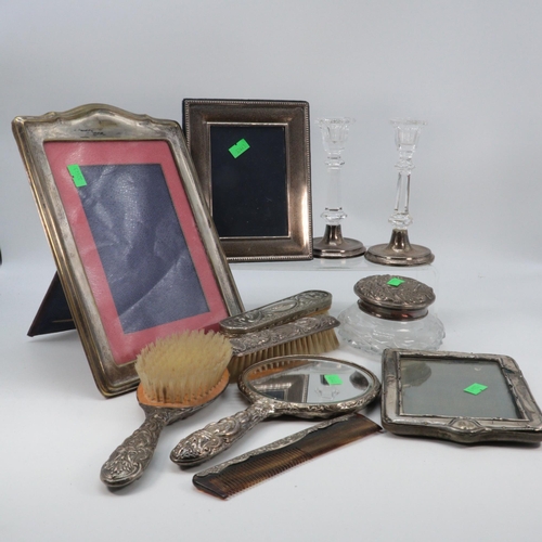 15 - Silver dressing table items including three hairbrushes and a hand mirror, Silver photo frame, two p... 