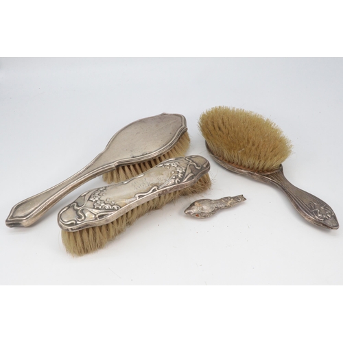 30 - Art Nouveau silver backed hairbrush, together with another matching brush, and another silver hairbr... 