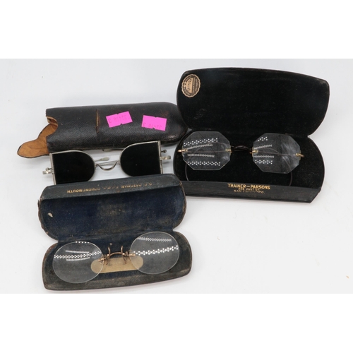 75 - Three pairs of cased vintage glasses.