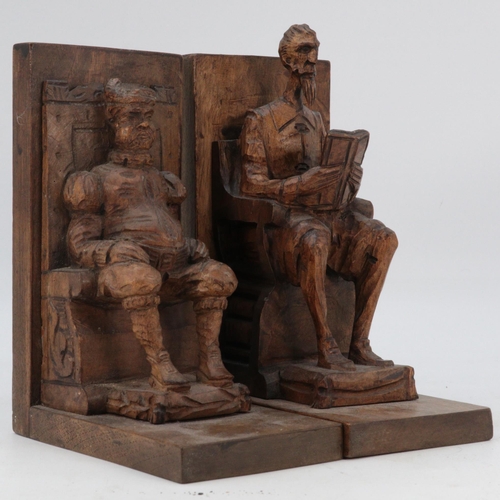 72 - Pair of Black Forest style carved bookends, depicting two men sitting