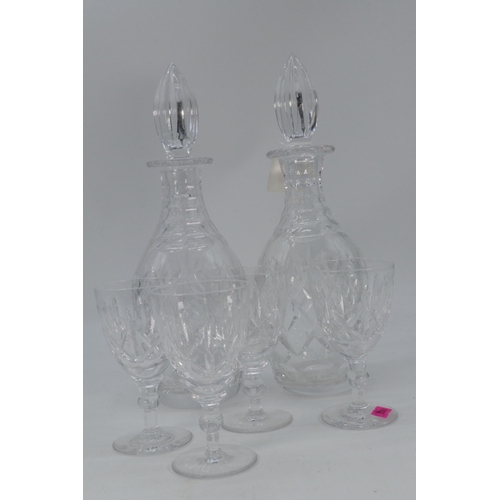 323 - Pair of Royal Doulton cut glass decanters together with four glasses. The glasses do not bare any ma... 