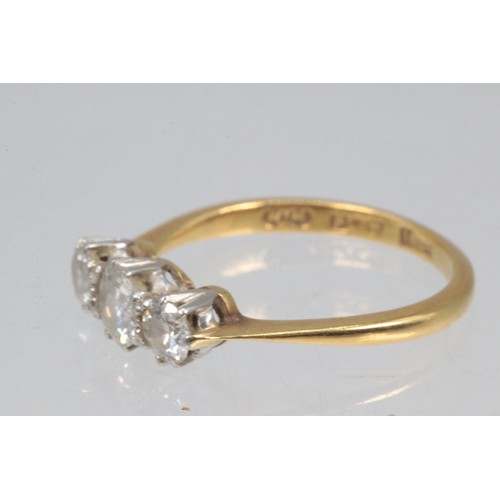 206E - 18ct gold and three stone diamond ring (size M)