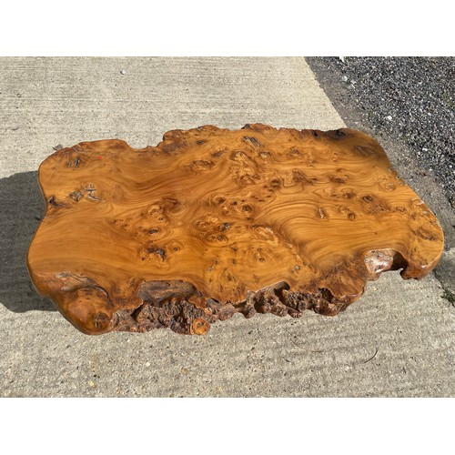 131 - Impressive walnut raw timber table, polished  on matching supporting legs. Approx. 135w x 87d x 45cm... 