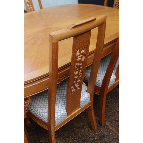 198 - Dining table and leaves together with 8 dining chairs (six chairs shown) measures approx. with two l... 