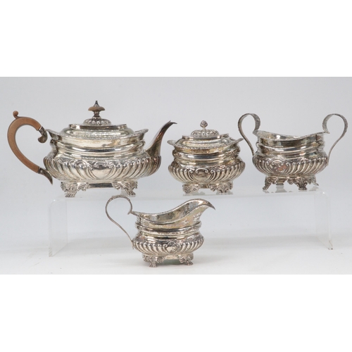 13 - Four piece silver hallmarked tea set, tea pot with wooden handle and finial (approx. weight 1100g)