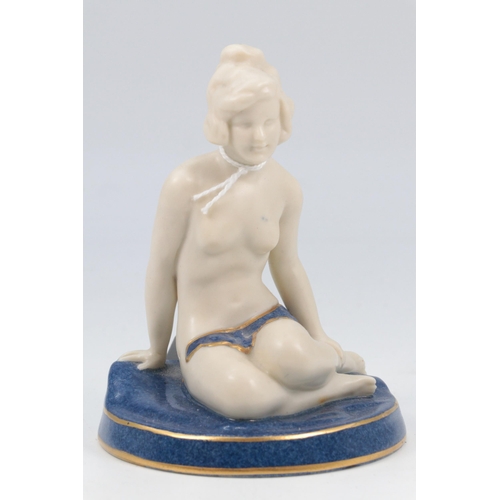 57 - Royal Worcester figurine of a bather sat on a rock.