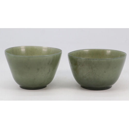 59 - Two spinach jade bowls (approx. 8cm diameter and 8.5cm diameter)