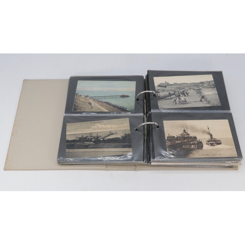 354 - Two albums of Bournemouth and surrounding area coastal scenes postcards