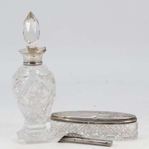 30 - A silver topped scent bottle measuring approx. 6