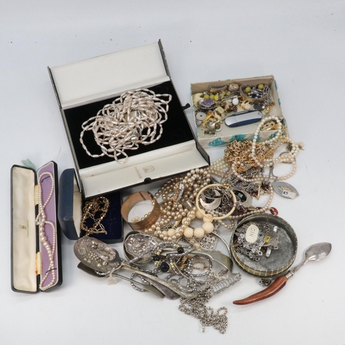 335 - A large quantity of assorted costume jewellery, plated flatware, curio items, flatware, all sort