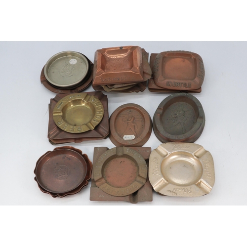 356 - A good quantity of vintage copper, brass and metal pub ashtrays including Johnnie Walker, Schweepp's... 