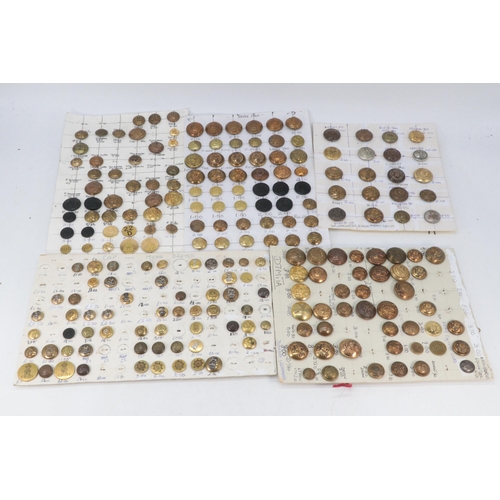 32 - Large quantity of military buttons mounted on board