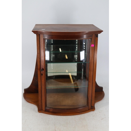 195 - Wall mounted display cabinet with curved glass front and mirrored back measures approx. 64cmW x 35cm... 