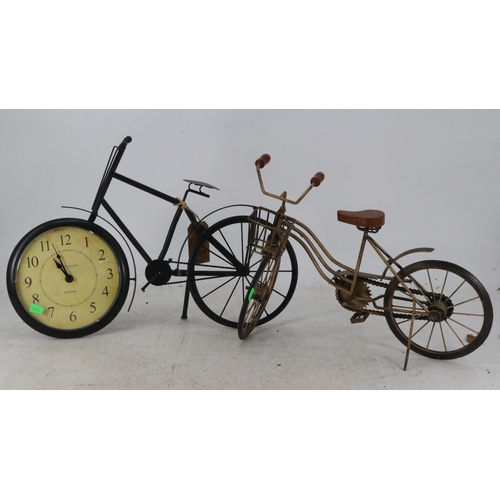 389 - Black metal painted bicycle clock together with a vintage style ornament bicycle