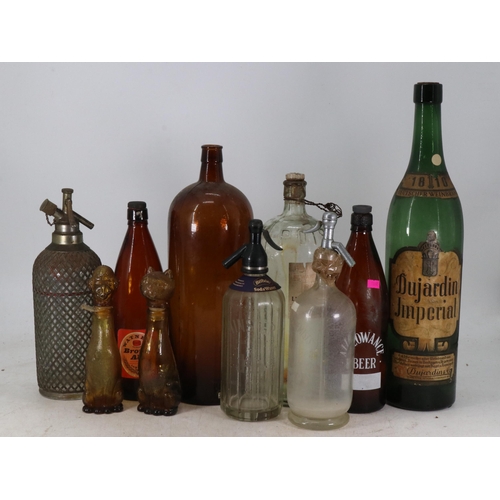 402 - Quantity of vintage beer, wine and chemical bottles together with three soda syphons and two novelty... 