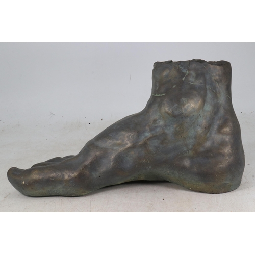 413 - Patinated bronzed finish sculpture in the form of a foot measures approx. 25.5cm tall