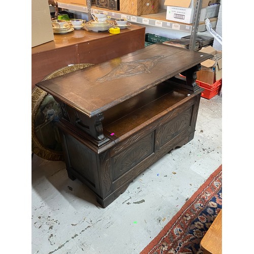 371 - Oak carved monks bench with fold over top and storage under the seat