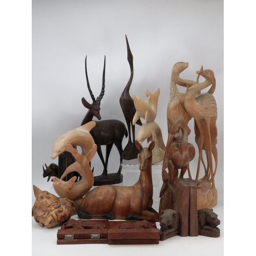 676 - Quantity of carved wooden animals to include large deer and antelope, bookends, herons (examine), do... 