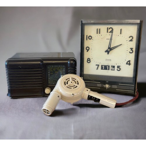 678 - A vintage Seiko Sonola transistor date clock together with Bakelite Radio and Bakelite hairdryer Orm... 