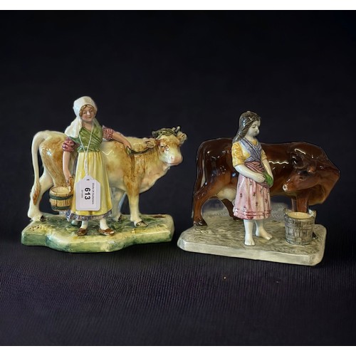 613 - A pair of continental porcelain figures of girls with cattle