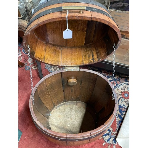 428 - An oak bound barrel with converted top for storage