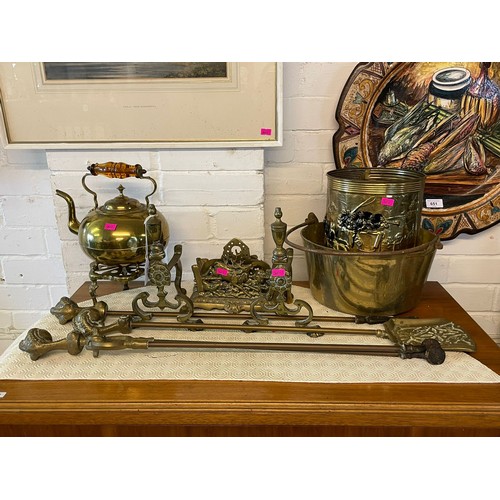 581 - Selection of brass fireside implements and accessories together with kettle on stand, Jam pan etc