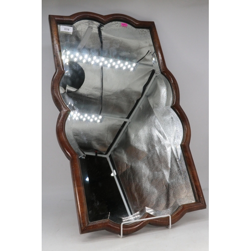 370 - Walnut framed bevel edged mirror, approx. 70cm x 42cm