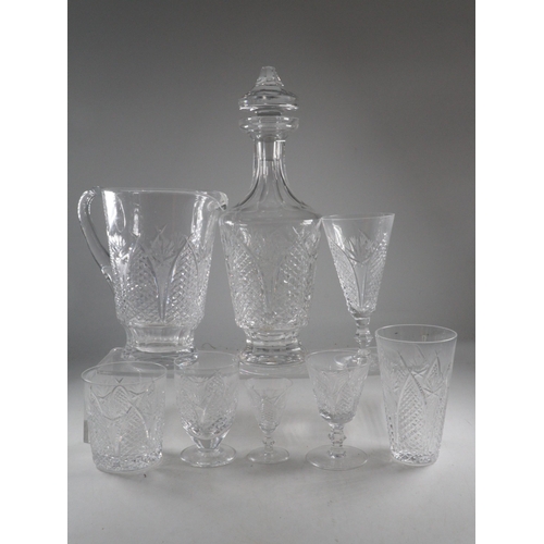 473 - Dunmore Waterford Suite of glass to include decanter, jug  etc, chip noted to one of tall tumblers