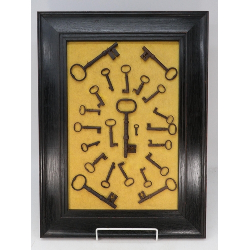 477 - Three framed displays of antique and later keys