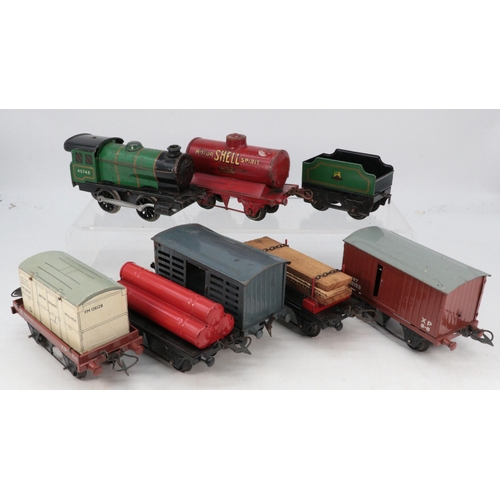 478 - A Vintage clockwork O gauge engine and tender, together with a quantity of boxed goods wagons, cross... 