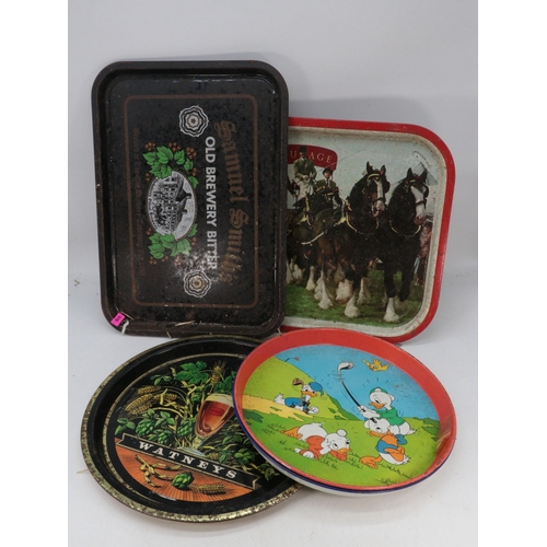 516 - A quantity of vintage and later tin trays to include Whitbread, Teachers, Whitehorse etc