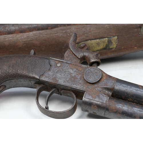 122A - 18c Powder shot pistol together with a similar showing more wear and a percussion cap muff pistol